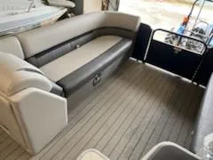 Slide: The Image of 2023 Sweetwater 2286SB boat interior with spacious seating and modern design. - 12