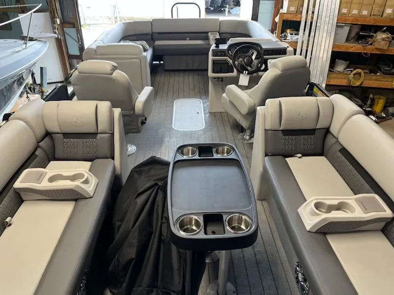 Slide: The Image of 2023 Sweetwater 2286SB pontoon boat interior with seating and steering console. - 3