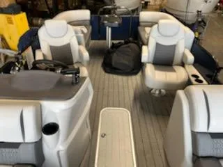 Slide: The Image of Interior of a 2023 Sweetwater 2286SB pontoon boat with plush seating. - 5