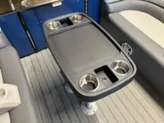 Slide: The Image of 2023 Sweetwater 2286SB boat interior table with cup holders. - 8
