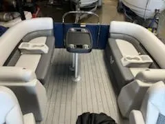 Slide: The Image of 2023 Sweetwater 2286SB pontoon boat interior with gray and white seating. - 9