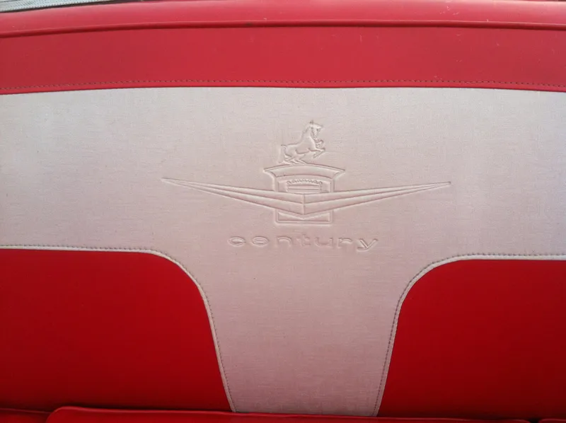 Slide: The Image of 1959 Century Coronado interior with red and white upholstery, featuring embossed logo design. - 6