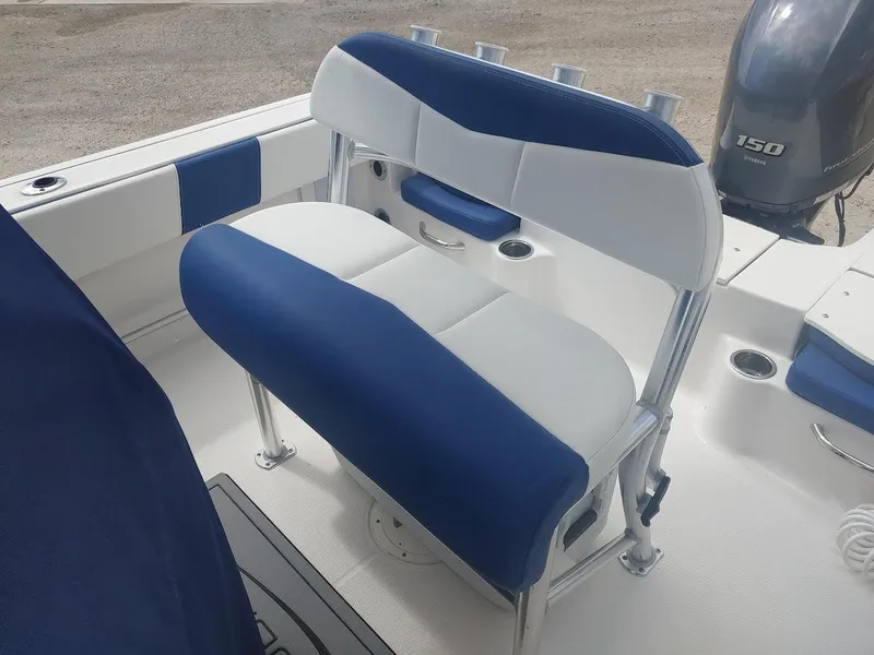 Slide: The Image of 2022 Robalo R180 Center Console boat seating with blue and white upholstery. - 11