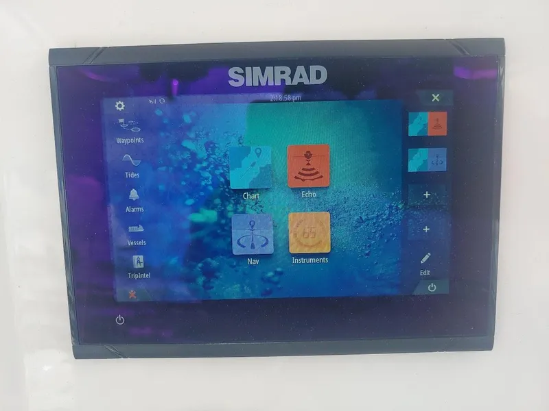 Slide: The Image of Simrad display on 2022 Robalo R180 Center Console boat, showing navigation and echo features. - 16
