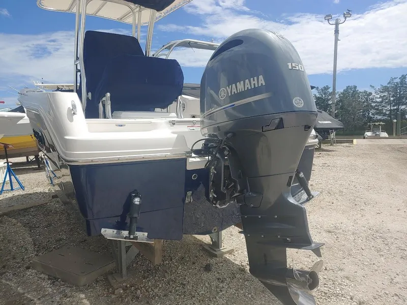 Slide: The Image of 2022 Robalo R180 Center Console boat with Yamaha 150 outboard motor. - 2