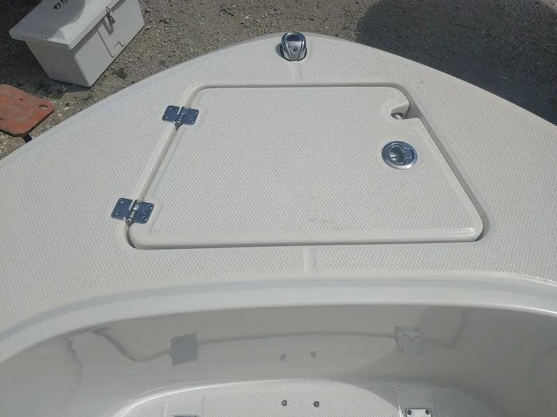 Slide: The Image of 2022 Robalo R180 Center Console boat deck with storage hatch. - 24