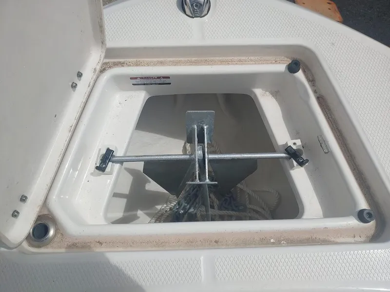 Slide: The Image of Anchor storage compartment on a 2022 Robalo R180 Center Console boat. - 25