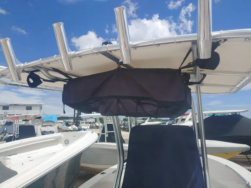 Slide: The Image of 2022 Robalo R180 Center Console boat with T-top and storage bag. - 6