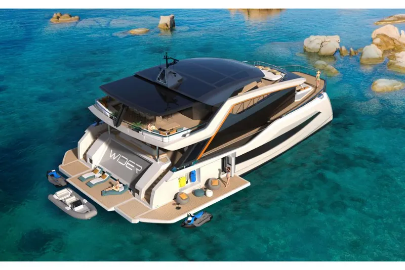 Slide: The Image of Luxurious 2023 Wider 92 yacht anchored in clear blue waters with spacious deck. - 2