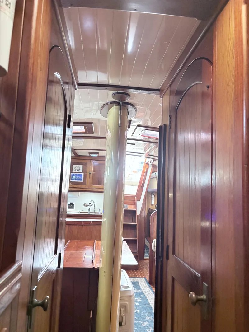 Slide: The Image of Interior view of 1984 Shannon Aegean 51 sailboat with wooden cabinetry and ceiling. - 13