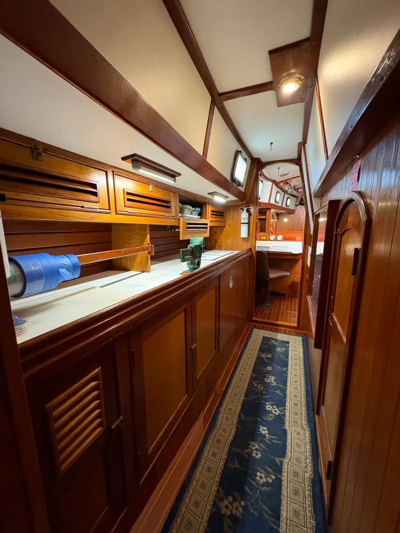 Slide: The Image of Interior of 1984 Shannon Aegean 51 yacht with wooden cabinetry and nautical decor. - 14