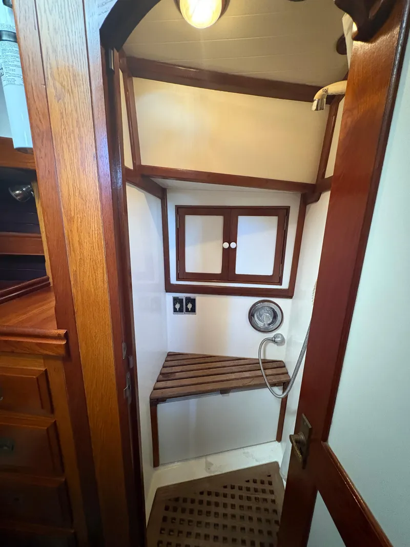 Slide: The Image of 1984 Shannon Aegean 51 yacht bathroom with wooden accents and compact design. - 16