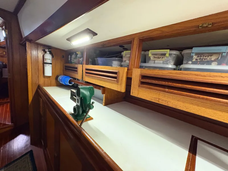 Slide: The Image of Interior of 1984 Shannon Aegean 51 with organized storage and workbench. - 17