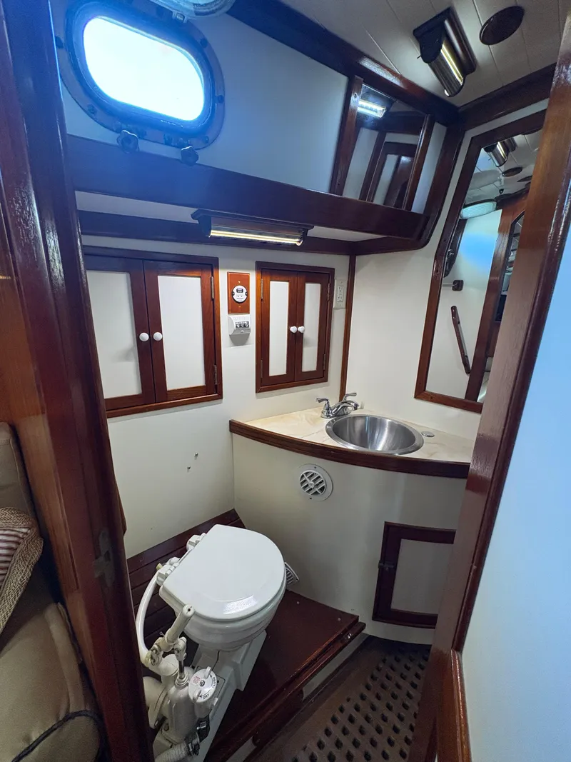 Slide: The Image of Interior of 1984 Shannon Aegean 51 yacht bathroom with sink and toilet. - 18