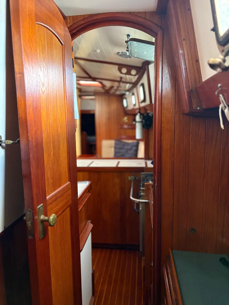 Slide: The Image of Interior of 1984 Shannon Aegean 51 sailboat with wooden finishes and cozy cabin. - 20