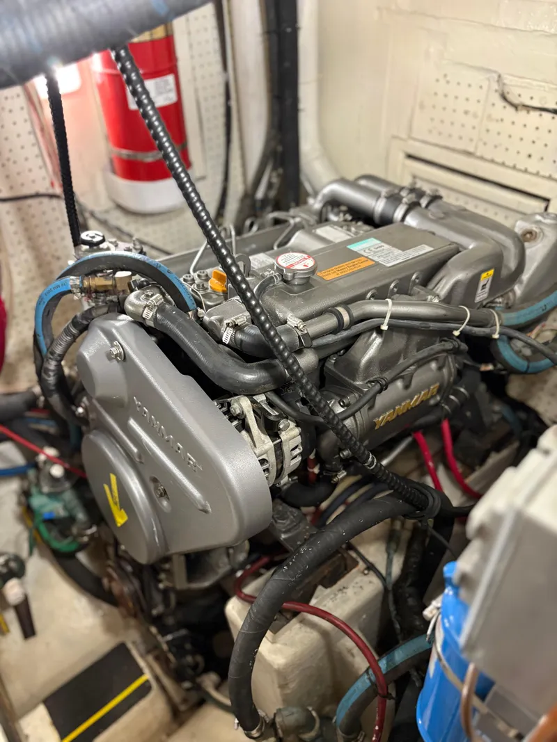 Slide: The Image of Engine room of 1984 Shannon Aegean 51 sailboat, featuring a Yanmar marine engine. - 27