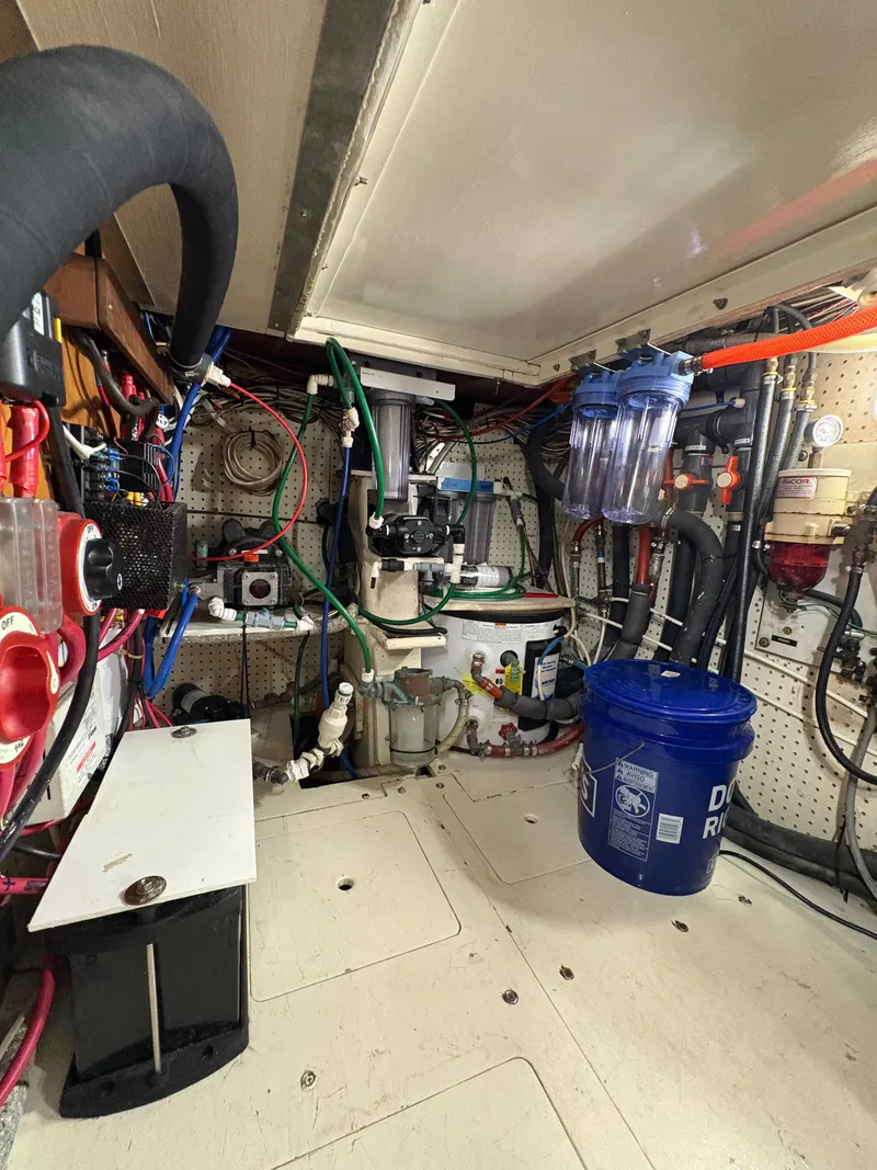 Slide: The Image of Engine room of 1984 Shannon Aegean 51 yacht with various equipment and wiring. - 28