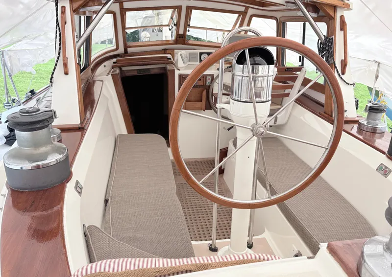 Slide: The Image of Cockpit of 1984 Shannon Aegean 51 sailboat with wooden wheel and seating. - 29