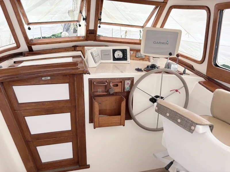 Slide: The Image of Cockpit of 1984 Shannon Aegean 51 sailboat with Garmin navigation system and wooden accents. - 31