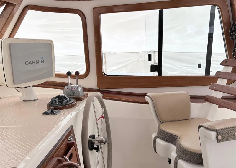 Slide: The Image of Interior of 1984 Shannon Aegean 51 yacht with Garmin navigation system and steering wheel. - 33