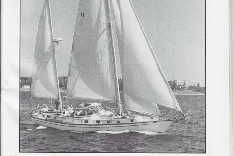 Slide: The Image of 1984 Shannon Aegean 51 sailboat cruising on open water with full sails. - 41