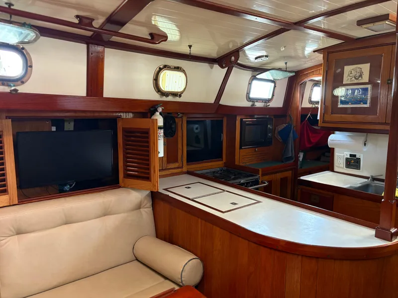 Slide: The Image of Interior of 1984 Shannon Aegean 51 yacht with wood finish and modern amenities. - 5