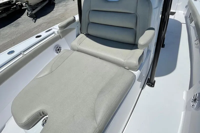Slide: The Image of 2022 Sportsman Masters 267OE Bay Boat with cushioned seating and armrests. - 5