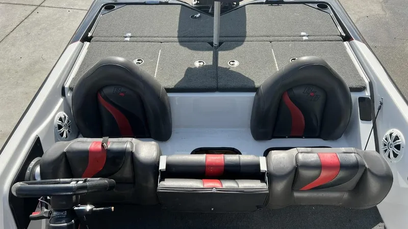 Slide: The Image of 2018 Bass Cat Pantera Classic boat interior with black and red seats. - 13