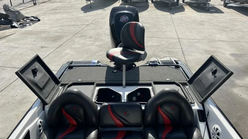 Slide: The Image of 2018 Bass Cat Pantera Classic boat interior with open storage compartments and seating. - 20