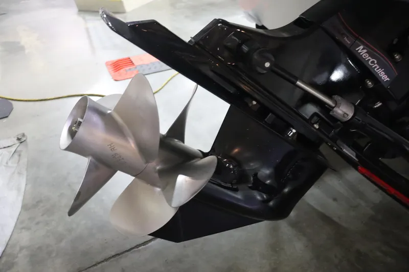 Slide: The Image of Close-up of 2023 Crownline 240SS boat propeller and MerCruiser engine. - 18