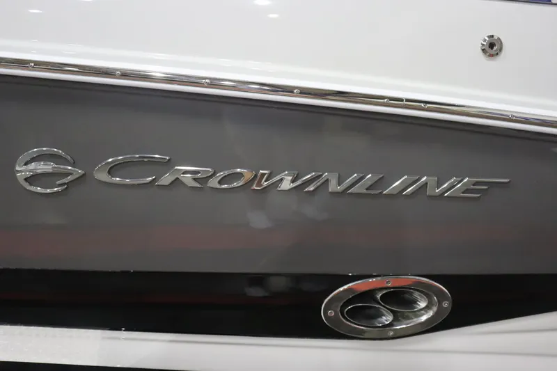 Slide: The Image of 2023 Crownline 240SS boat side view with logo and exhaust. - 4