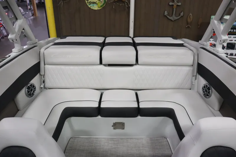 Slide: The Image of 2023 Crownline 240SS boat interior with white and black seating. - 8