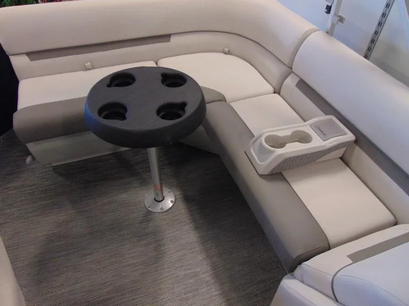 Slide: The Image of 2023 Godfrey Sweetwater Xperience 1680 FX interior seating with cup holders and table. - 3