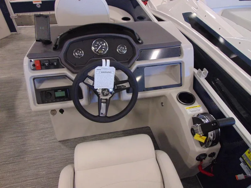 Slide: The Image of 2023 Godfrey Sweetwater Xperience 1680 FX boat dashboard and steering wheel. - 5