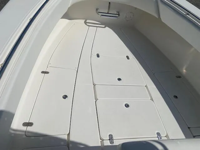 Slide: The Image of 2004 Fountain 34 CC boat deck with storage compartments. - 20