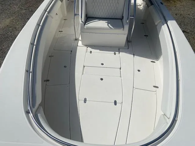 Slide: The Image of 2004 Fountain 34 CC boat deck with seating and storage compartments. - 23