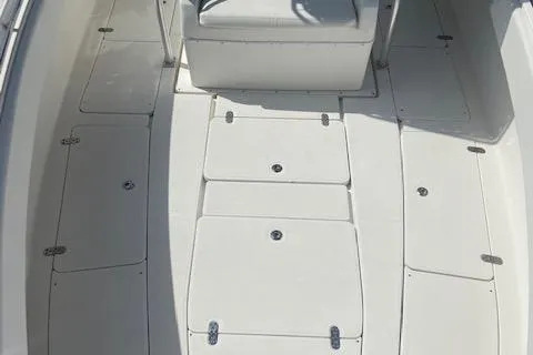 Slide: The Image of 2004 Fountain 34 CC boat deck with storage compartments. - 26