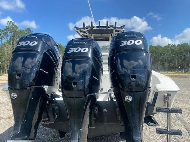 Slide: The Image of 2004 Fountain 34 CC boat with triple 300 horsepower outboard engines. - 6