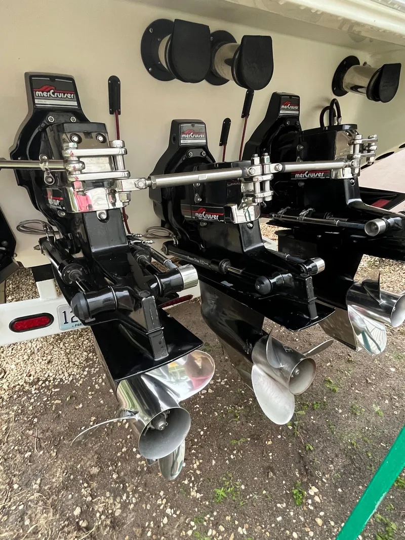 Slide: The Image of Triple MerCruiser outdrives on a 1992 Fountain 42 Lightning boat, showcasing powerful propulsion. - 11