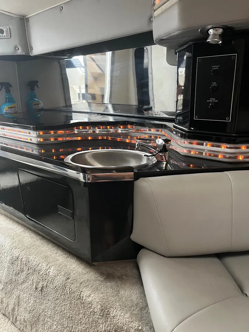 Slide: The Image of Luxurious interior of 1992 Fountain 42 Lightning boat with sleek sink and ambient lighting. - 14