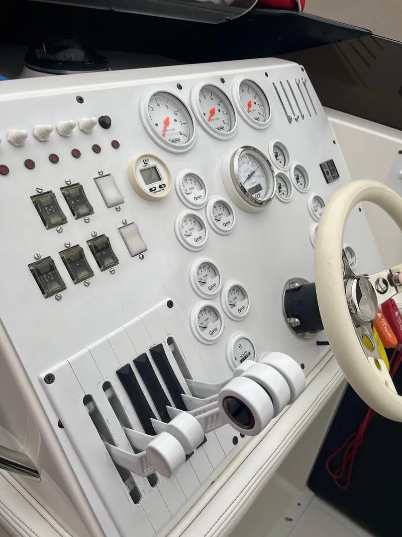 Slide: The Image of Control panel of a 1992 Fountain 42 Lightning boat with gauges and switches. - 17