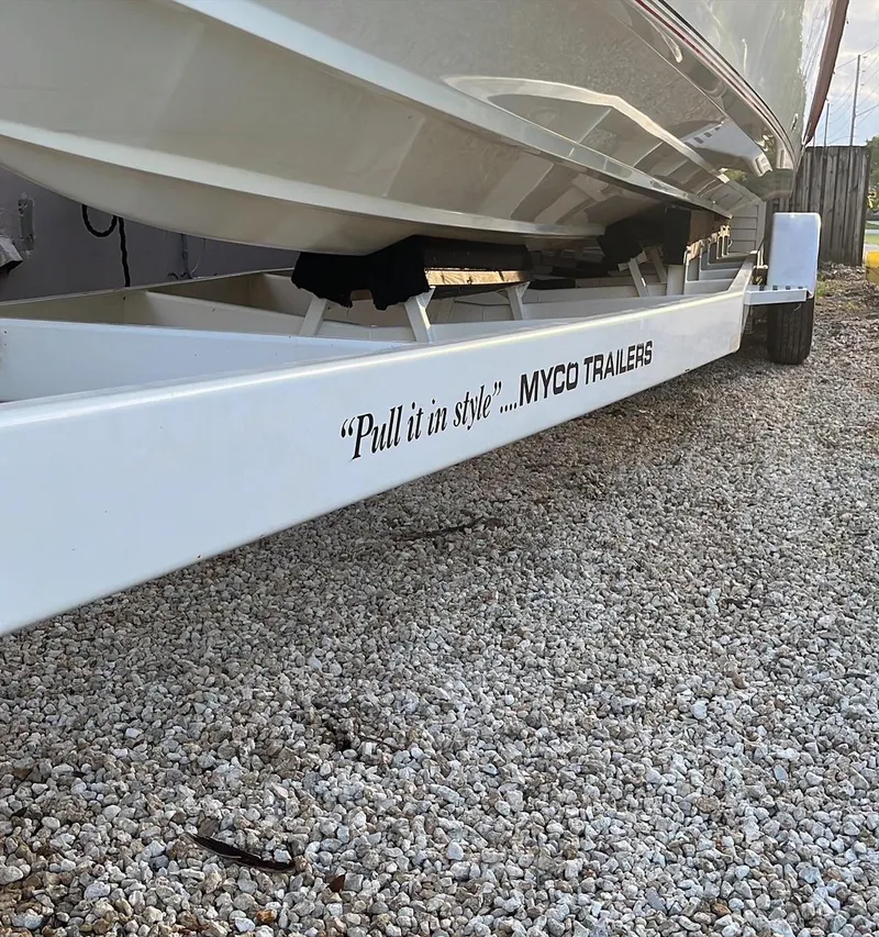 Slide: The Image of 1992 Fountain 42 Lightning boat on Myco trailer, gravel ground, "Pull it in style" slogan. - 5