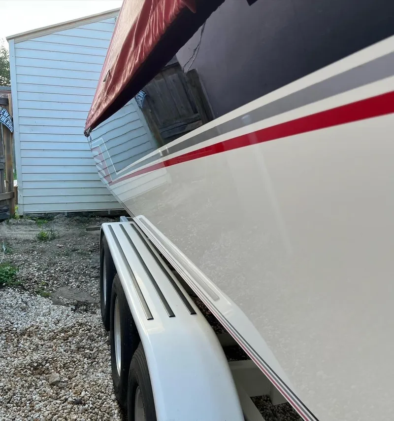 Slide: The Image of 1992 Fountain 42 Lightning boat on trailer, side view with red cover. - 6