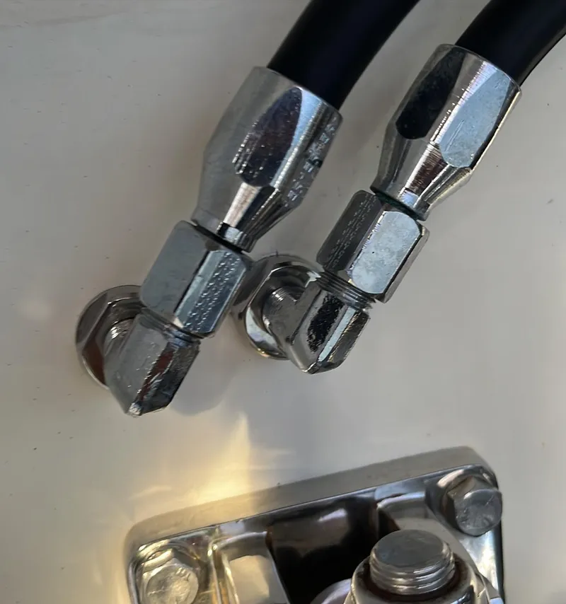 Slide: The Image of Close-up of metal fittings and hoses on a 1992 Fountain 42 Lightning boat. - 9