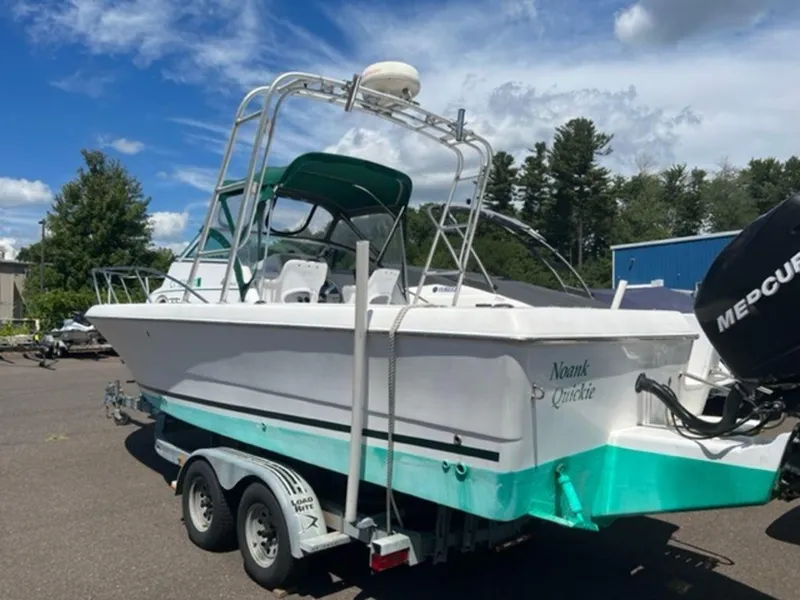 Slide: The Image of 2001 Pro-Line 25 Walkaround boat on trailer with Mercury outboard motor. - 12