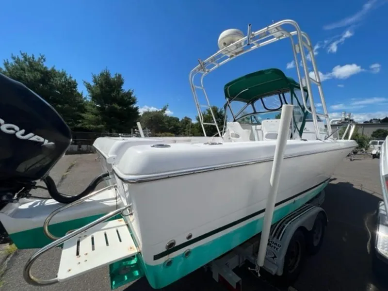 Slide: The Image of 2001 Pro-Line 25 Walkaround boat on trailer with Mercury outboard motor. - 14