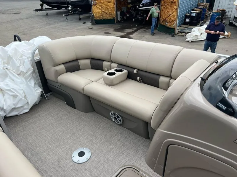 Slide: The Image of 2023 Sun Tracker PARTY BARGE® 22 RF XP3 interior seating area with beige upholstery. - 2