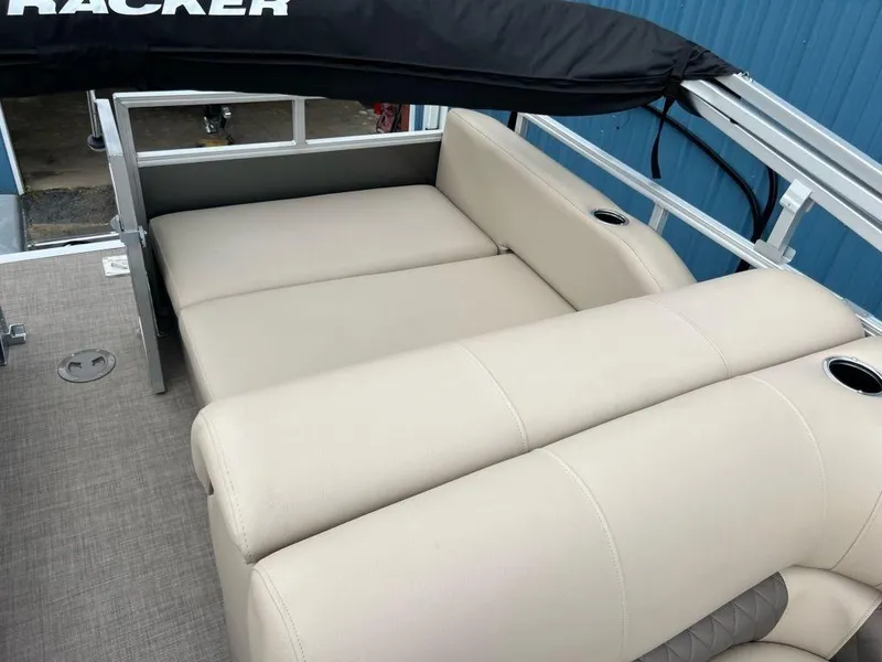 Slide: The Image of 2023 Sun Tracker PARTY BARGE® 22 RF XP3 interior seating area with beige upholstery. - 3