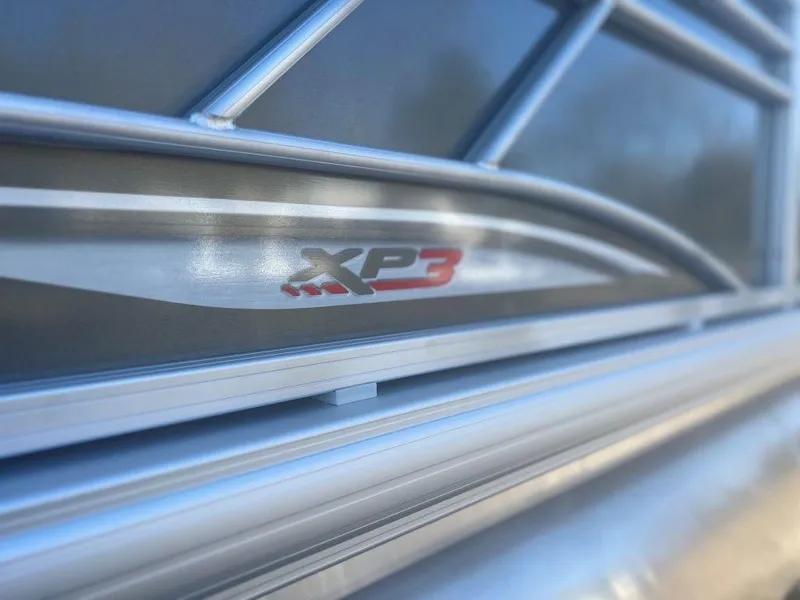 Slide: The Image of Close-up of 2023 Sun Tracker PARTY BARGE® 22 RF XP3 logo on boat railing. - 8