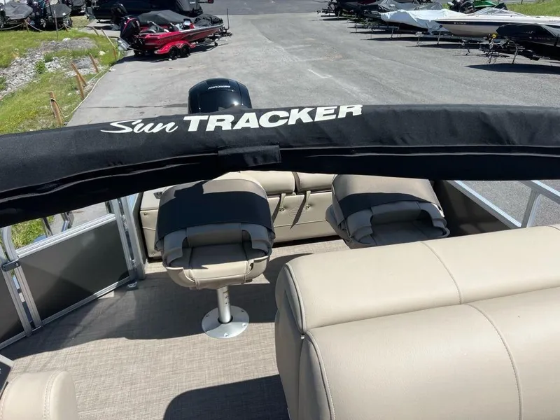 Slide: The Image of 2023 Sun Tracker FISHIN' BARGE® 22 DLX pontoon boat interior with seating and canopy. - 8